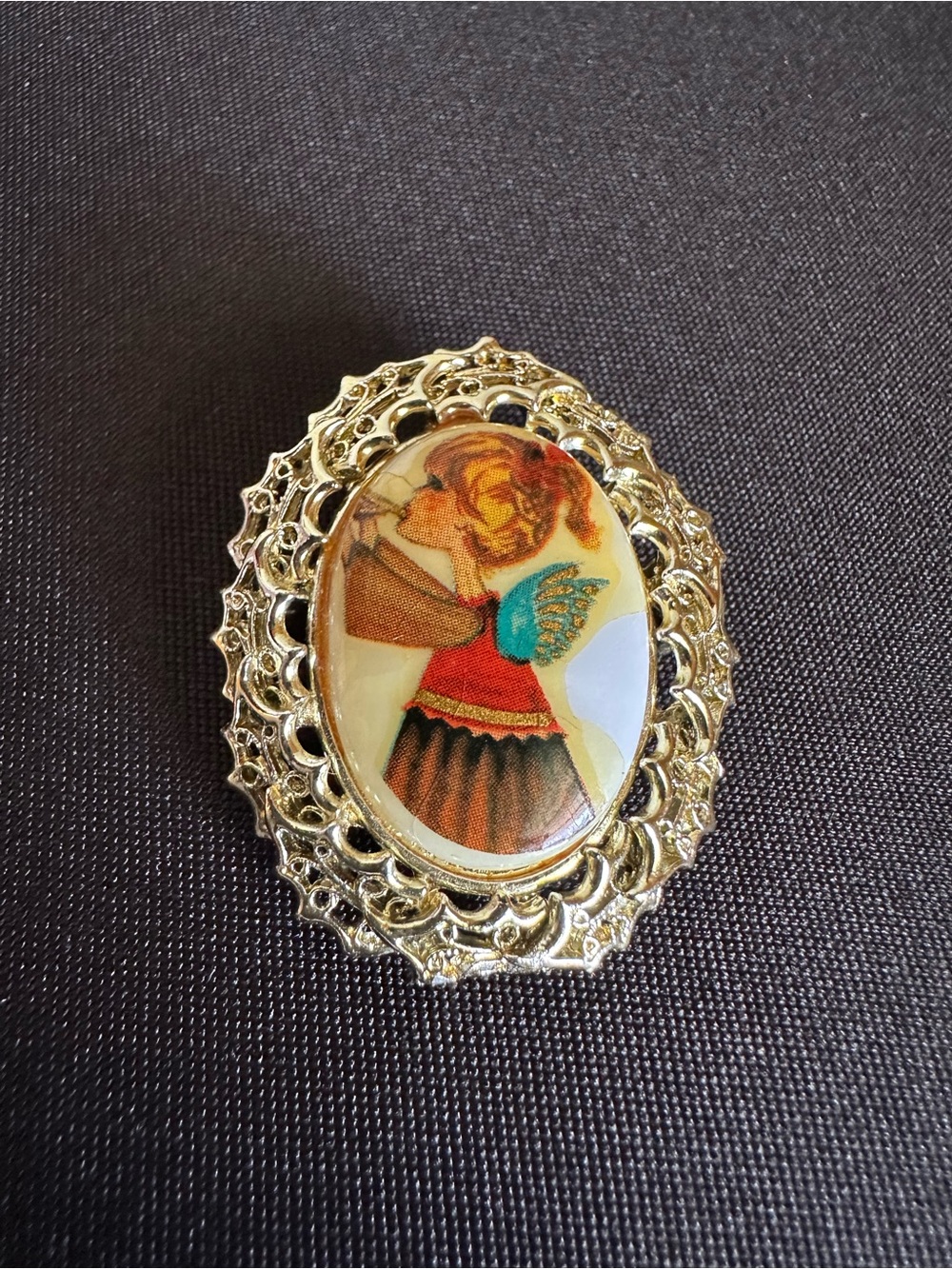 Vintage Tancer II girl angel playing a horn cameo brooch